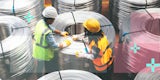 Two technicians handling massive coils of fiber optic cables.