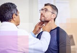 A man getting his thyroid checked.